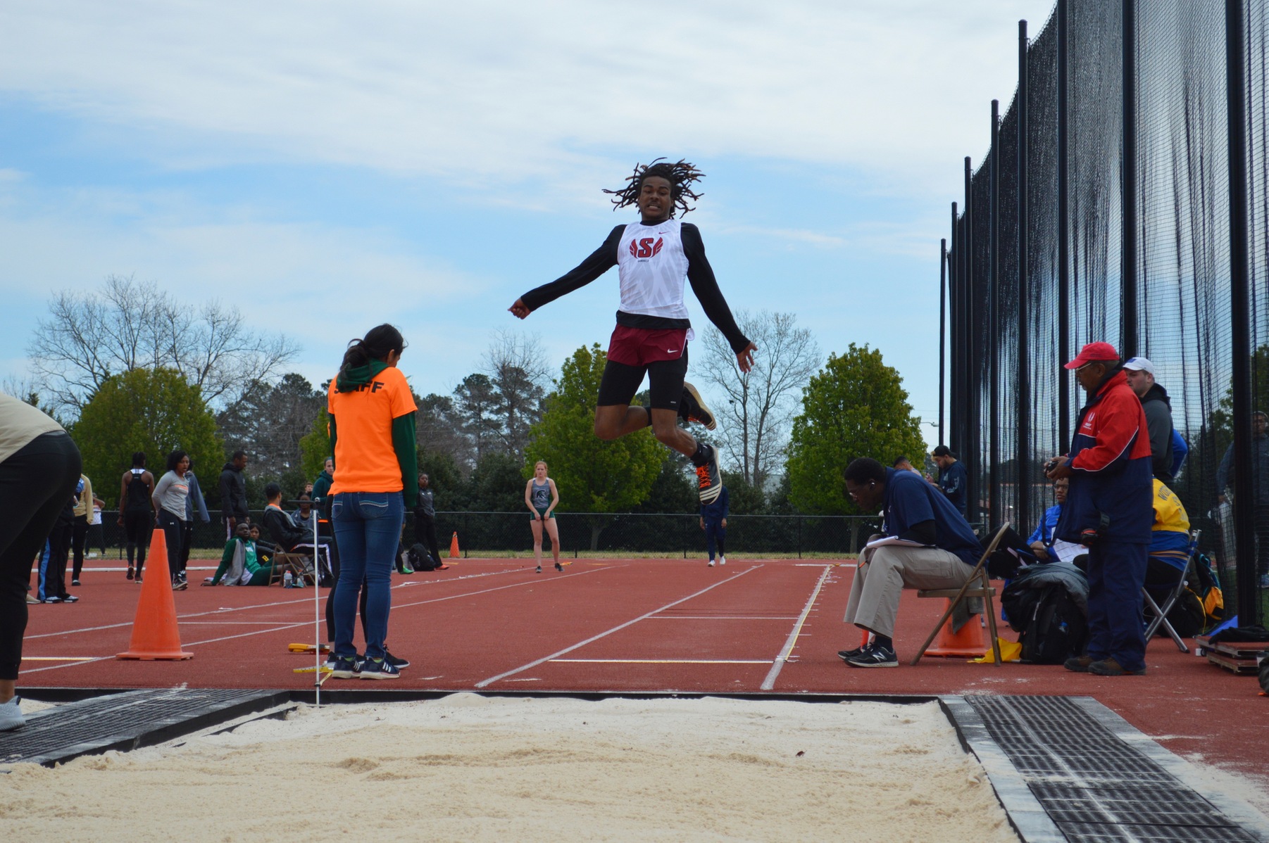 Tyrese Kelly competes in the long jump at Mount Olive on March 24, 2018.